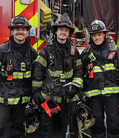 Three firefighters in bunker gear